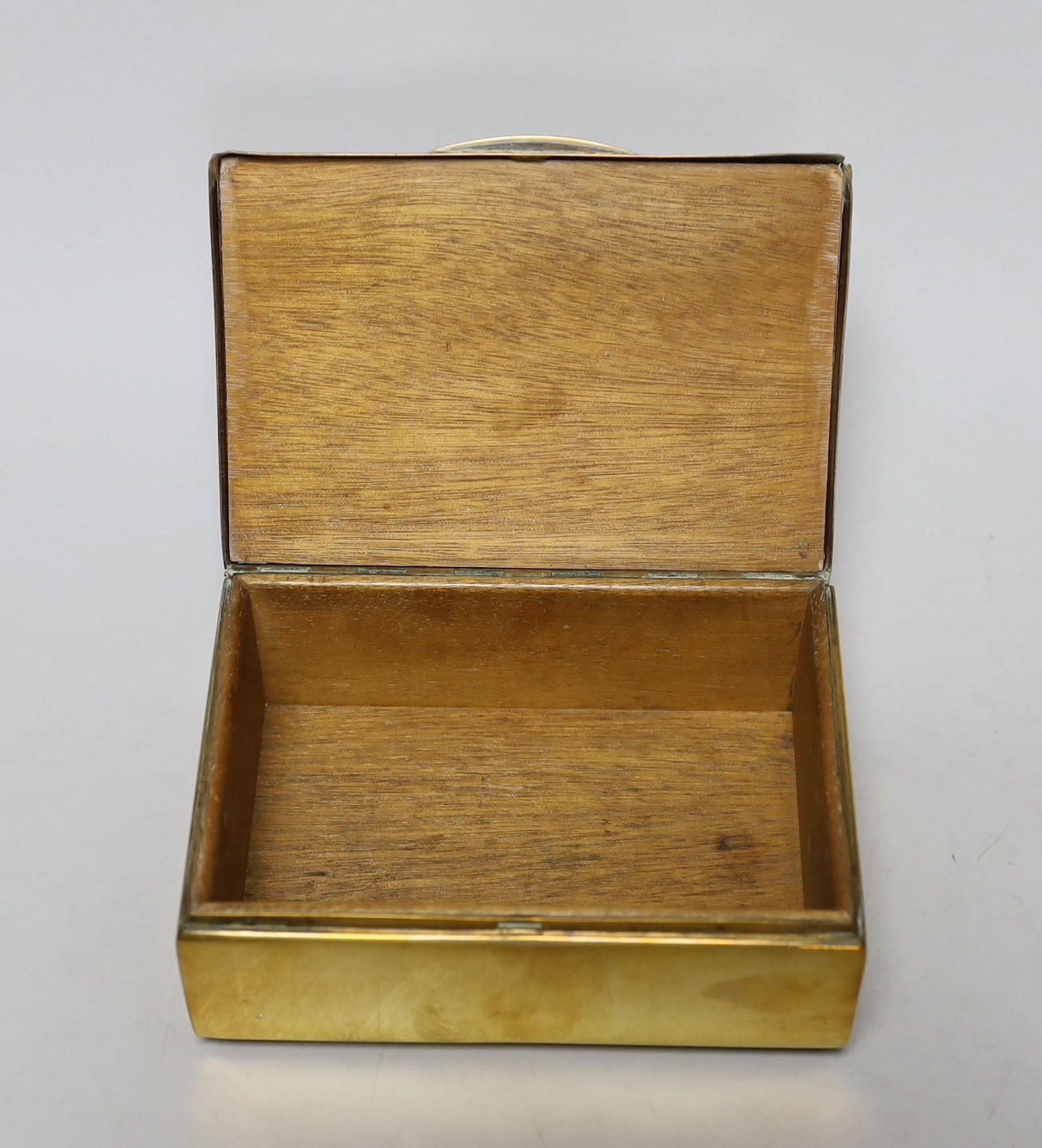 A burr oak topped brasswork cigarette box, 14cm wide, 10cm deep